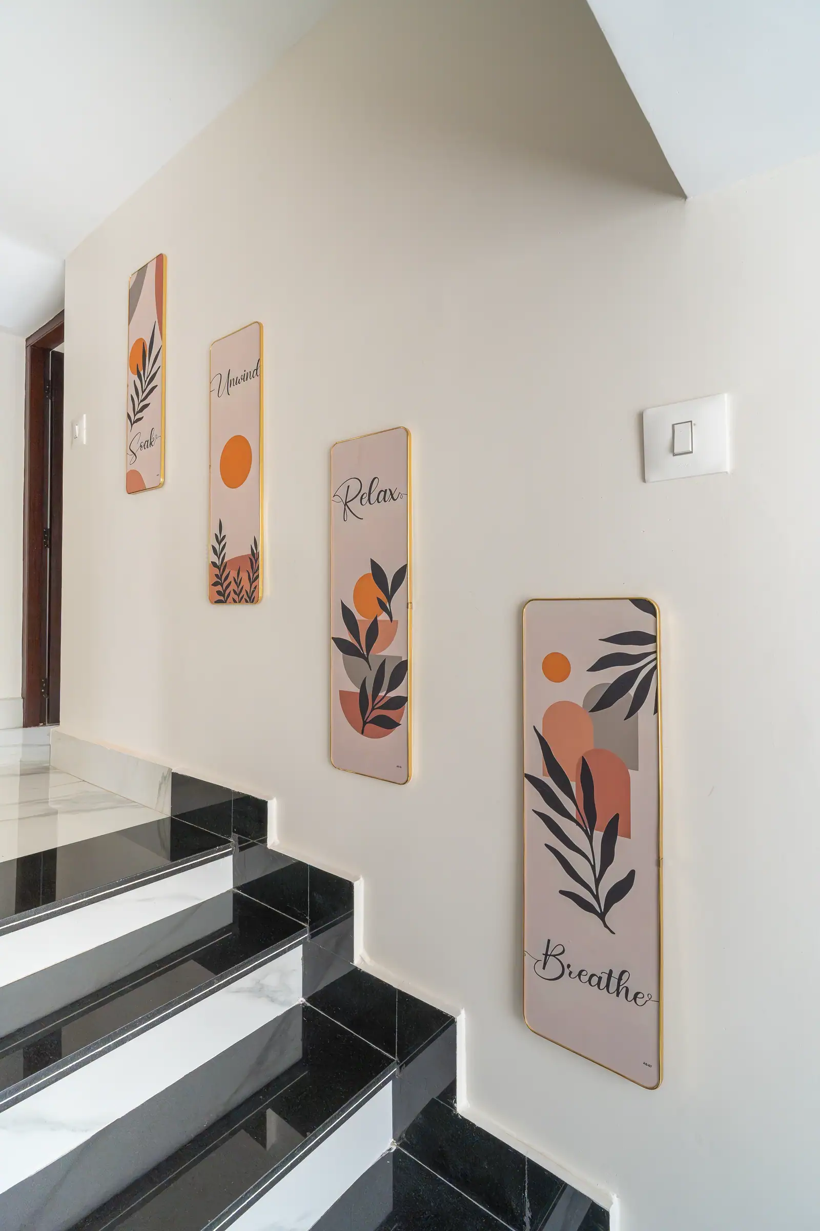 Thoughtful wall art invites a moment of stillness as you ascend through our heritage home.