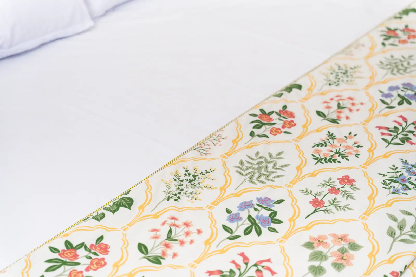 Delicate botanical motifs bring the lush gardens of Udupi into the comfort of your private sanctuary.