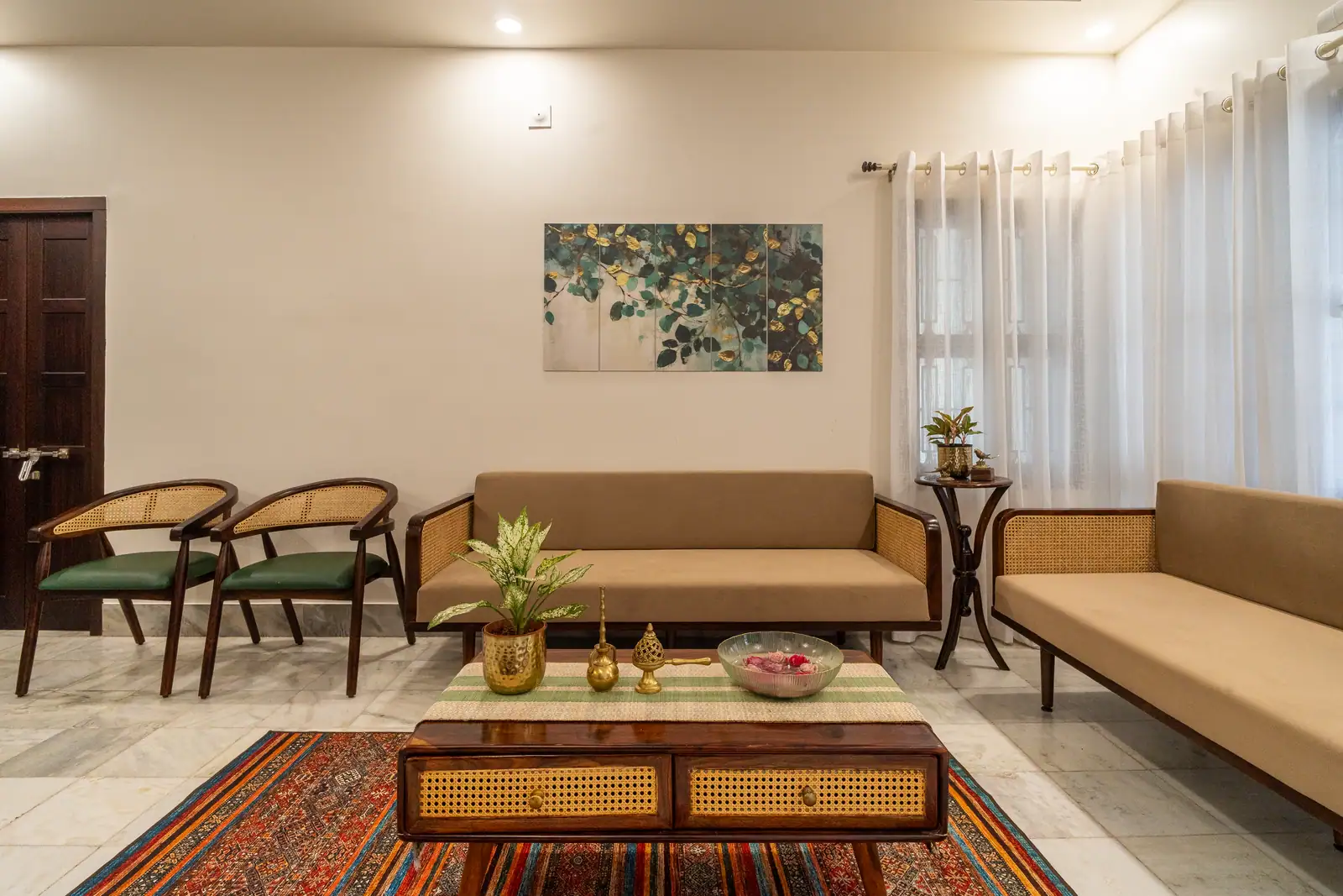 The sun-filled living room with cane seating and kilim rugs