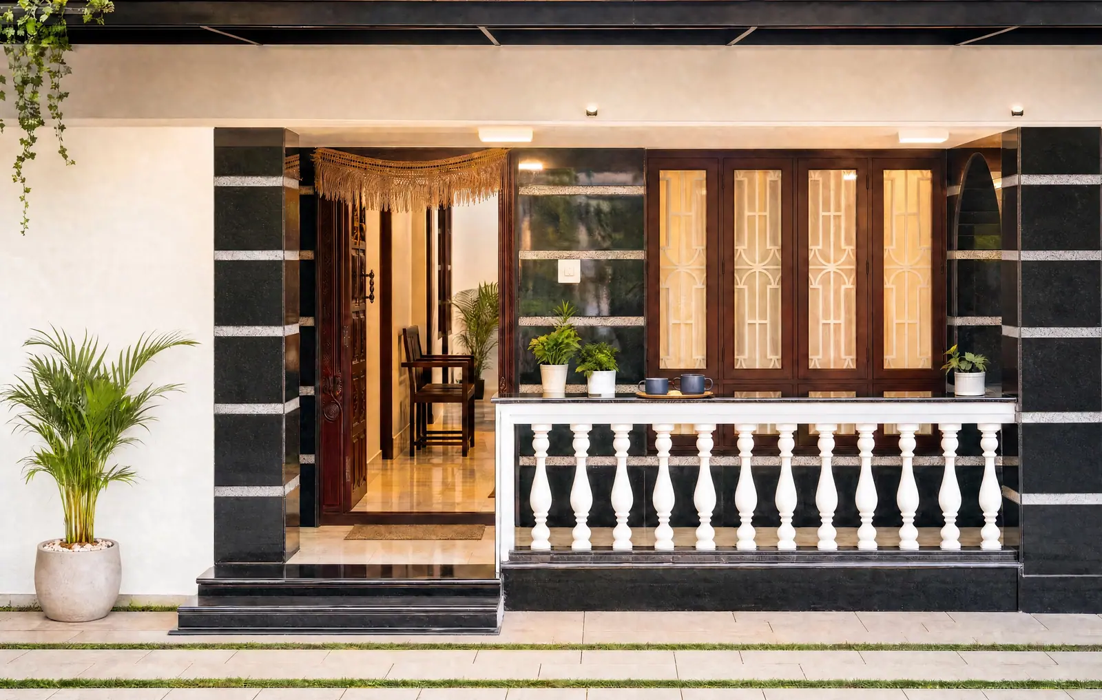 The warm, lamp-lit entrance porch welcoming guests into Spanda